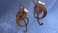 Gold treble clef note stud earrings