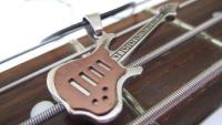 Bronze 2 tone guitar pendant on thin leather cord