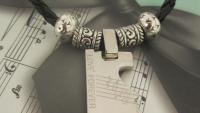 Musical Notes Jigsaw Tag Pendant sleek 'n silver style