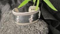 Silver and Black Leather Cuff Bangle with G Clef Design
