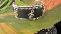 Silver and Black Leather Cuff Bangle with G Clef Design